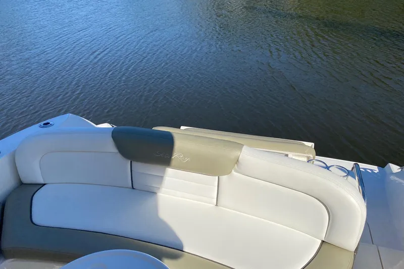 Slide: The Image of 2007 Sea Ray Sundancer 310 boat with white seating, overlooking calm water. - 13