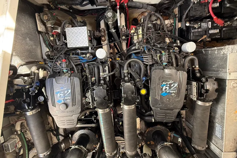 Slide: The Image of Engine compartment of a 2007 Sea Ray Sundancer 310 with twin MerCruiser 6.2 MPI engines. - 48