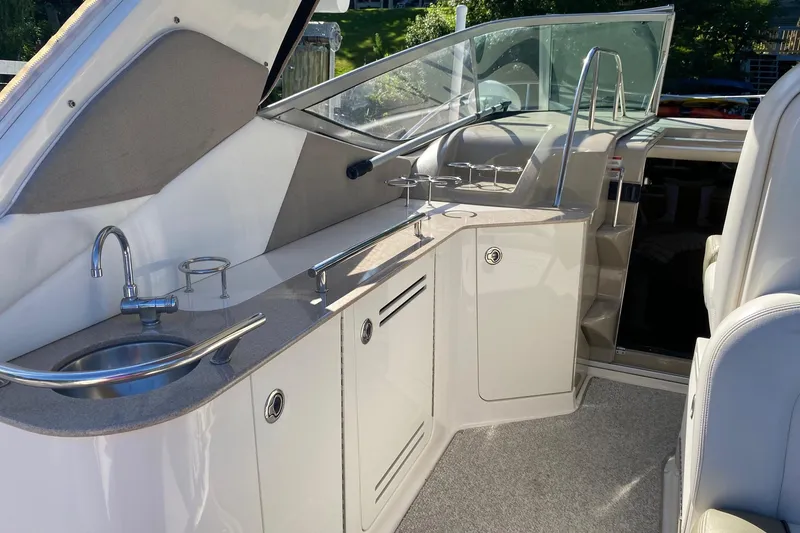 Slide: The Image of 2007 Sea Ray Sundancer 310 yacht interior with sink and seating area. - 10