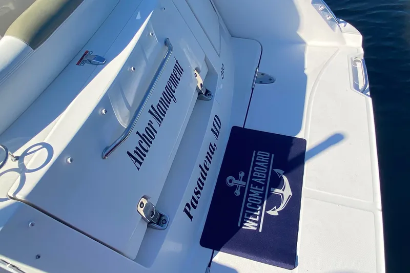 Slide: The Image of 2007 Sea Ray Sundancer 310 boat deck with "Welcome Aboard" mat and "Anchor Management" text. - 5