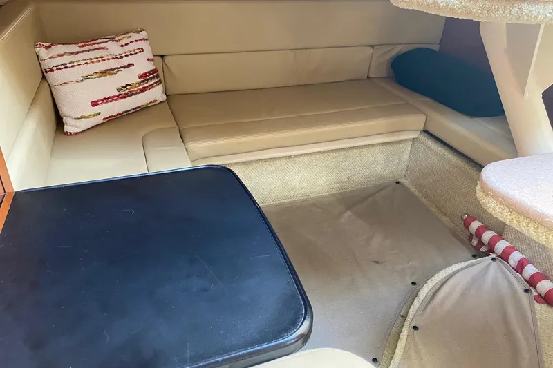 Slide: The Image of Interior cabin of 2007 Sea Ray Sundancer 310 with beige seating and table. - 32