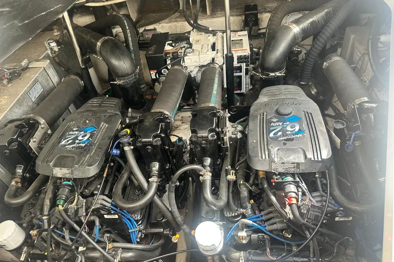 Slide: The Image of Engine compartment of a 2007 Sea Ray Sundancer 310 with twin MerCruiser engines. - 50