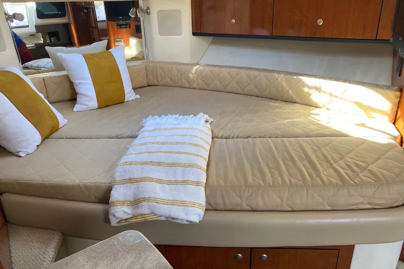Slide: The Image of Luxurious cabin interior of 2007 Sea Ray Sundancer 310 with cozy bedding and pillows. - 38