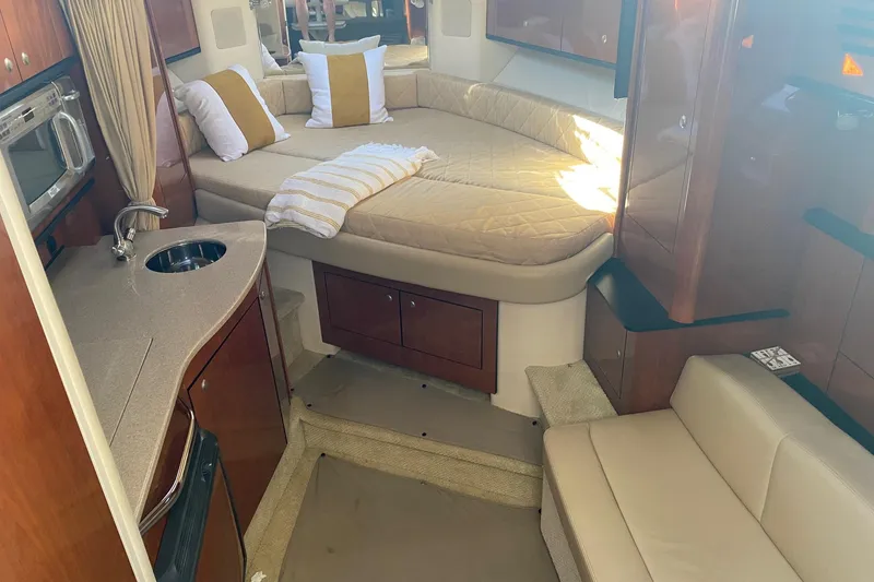 Slide: The Image of Luxurious interior of 2007 Sea Ray Sundancer 310 yacht with cozy bed and kitchenette. - 37