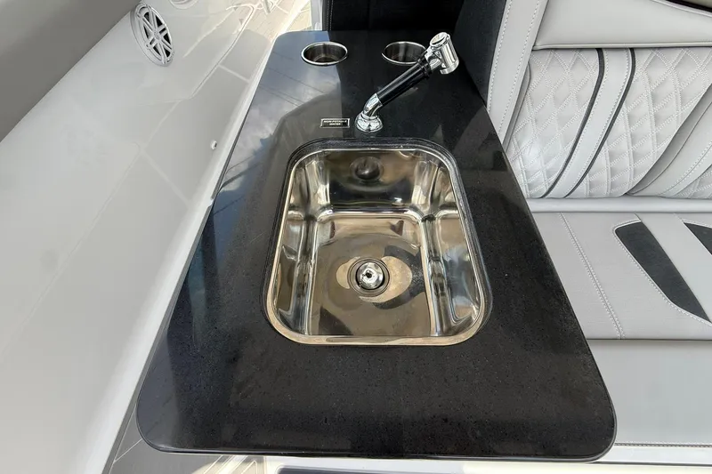 Slide: The Image of Luxury sink area on 2027 Monterey Elite 30 OB boat with sleek design and modern fixtures. - 13