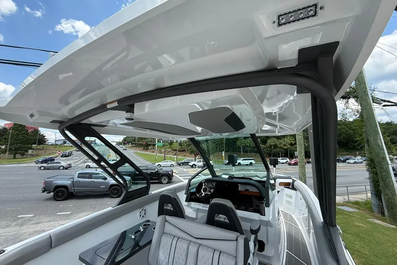 Slide: The Image of 2027 Monterey Elite 30 OB boat interior with sleek design and modern dashboard. - 12
