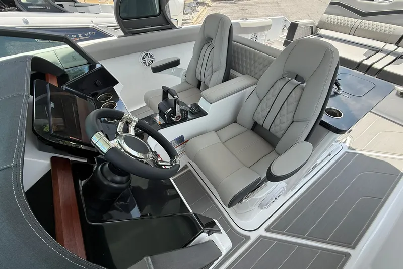 Slide: The Image of Luxurious cockpit of 2027 Monterey Elite 30 OB boat with modern steering and seating. - 8