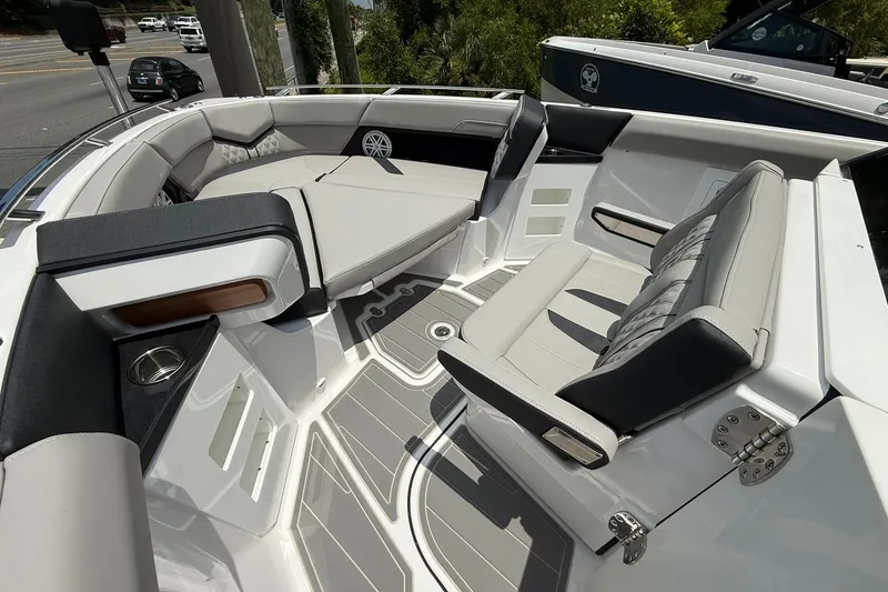 Slide: The Image of Luxurious seating area on the 2027 Monterey Elite 30 OB boat, featuring sleek design and comfort. - 4
