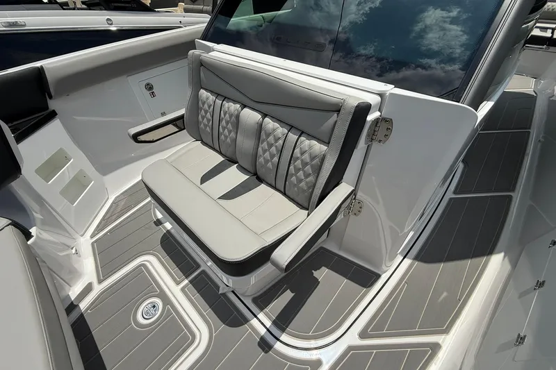 Slide: The Image of Luxury seating on 2027 Monterey Elite 30 OB boat, featuring sleek design and premium materials. - 5