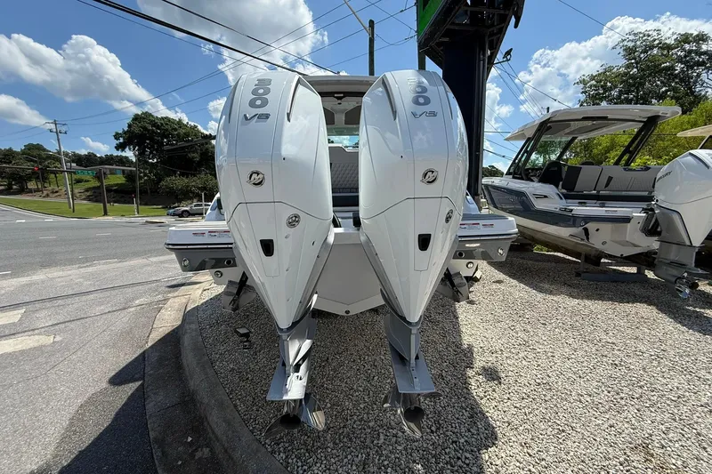 Slide: The Image of 2027 Monterey Elite 30 OB boat with dual outboard engines on display. - 2
