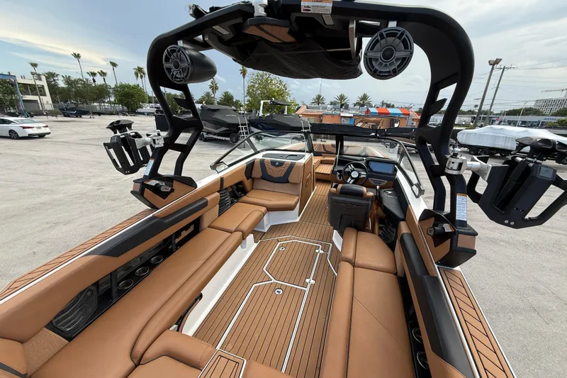 Slide: The Image of 2021 Nautique Super Air Nautique G25 Coastal Edition interior with luxurious seating and advanced features. - 9