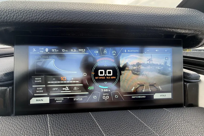 Slide: The Image of 2021 Nautique Super Air Nautique G25 Coastal Edition dashboard display with navigation and control settings. - 11