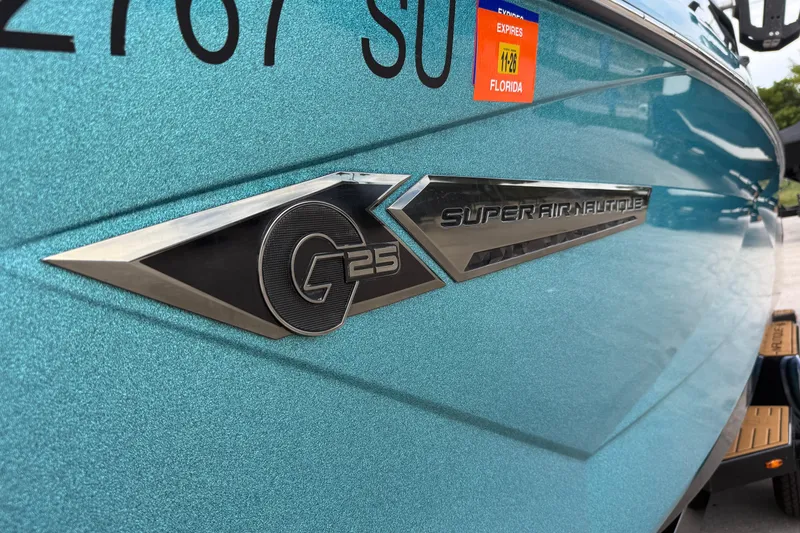 Slide: The Image of 2021 Nautique Super Air Nautique G25 Coastal Edition boat emblem, Florida registration visible. - 14