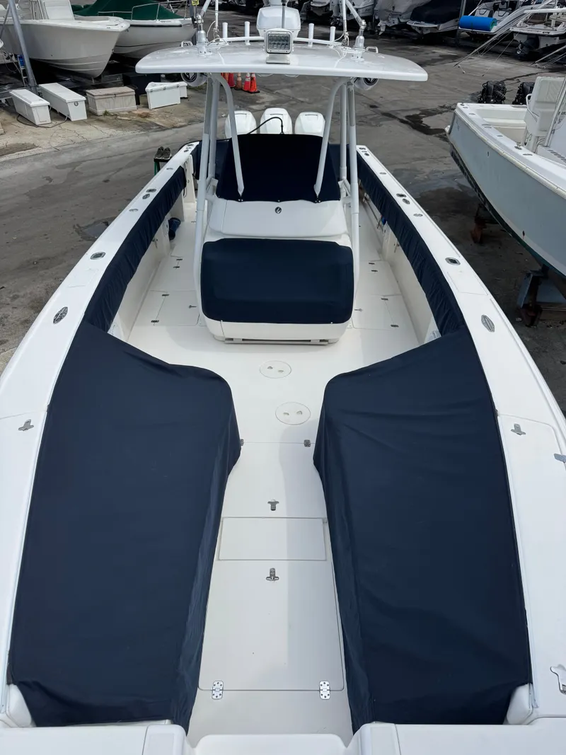 Slide: The Image of 2004 Intrepid 370 Center Console with blue upholstery and spacious deck. - 4