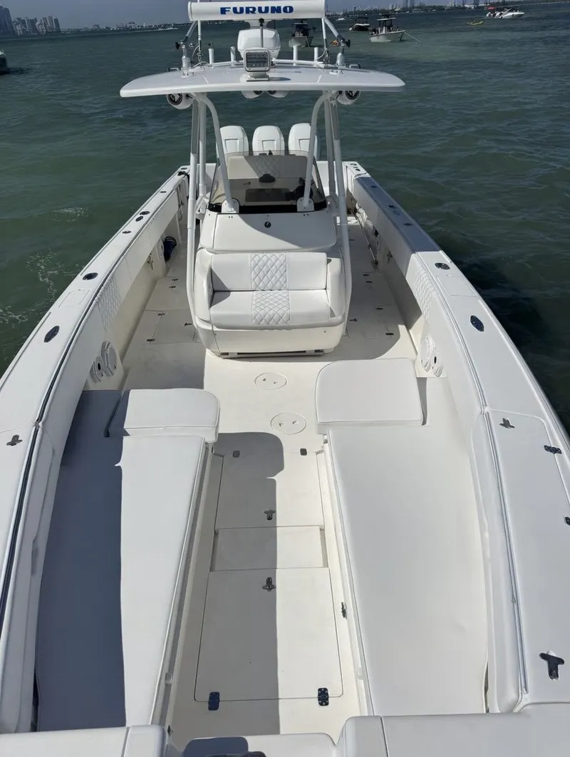 Slide: The Image of 2004 Intrepid 370 Center Console on the water. - 2