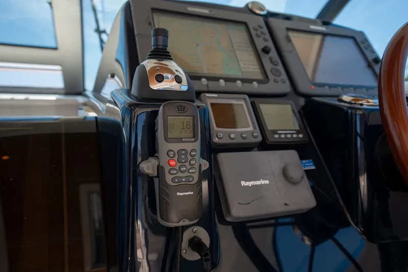 Slide: The Image of The image shows the helm of a 2008 Tiara Yachts 4300 Sovran with navigation equipment. - 14