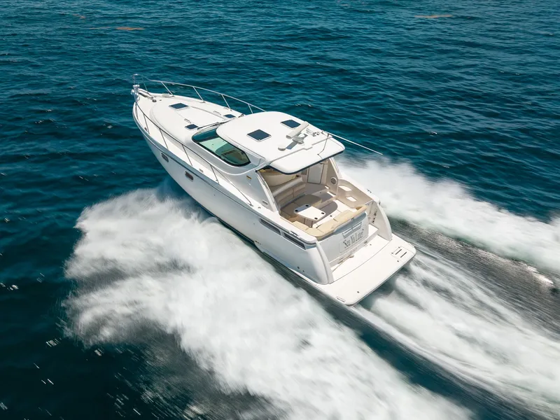 Slide: The Image of 2008 Tiara Yachts 4300 Sovran cruising on the water. - 11