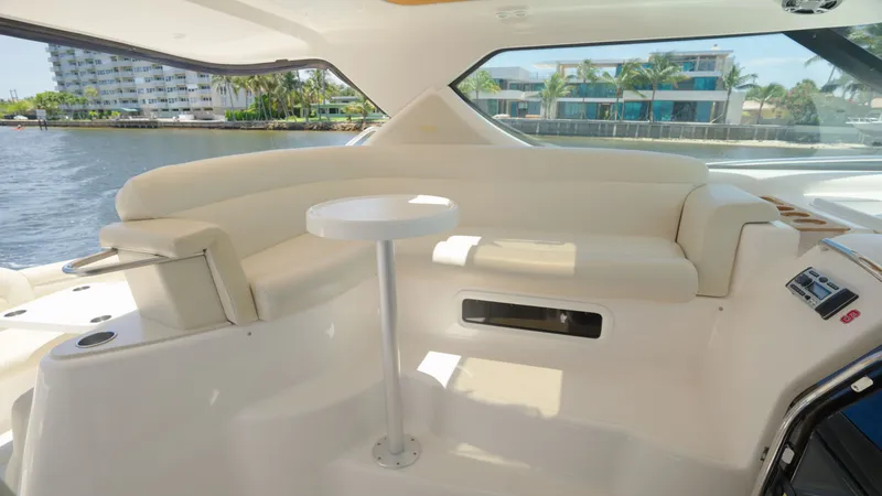 Slide: The Image of Interior of a 2008 Tiara Yachts 4300 Sovran with beige seating area and table. - 19