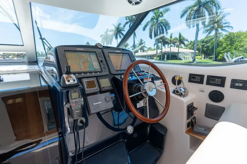 Slide: The Image of The cockpit of a 2008 Tiara Yachts 4300 Sovran with modern navigation equipment. - 13