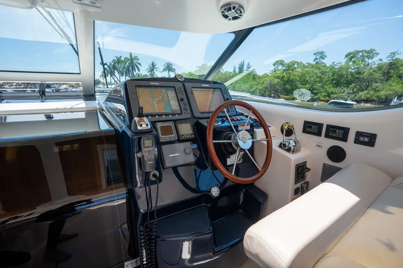 Slide: The Image of The cockpit of a 2008 Tiara Yachts 4300 Sovran with modern navigation electronics. - 12