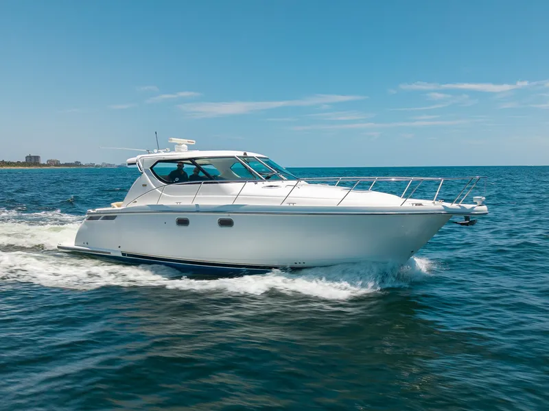 Slide: The Image of A 2008 Tiara Yachts 4300 Sovran cruising on the sea under a clear sky. - 1