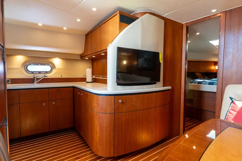 Slide: The Image of Interior of the 2008 Tiara Yachts 4300 Sovran with elegant wood finish and modern kitchen. - 27