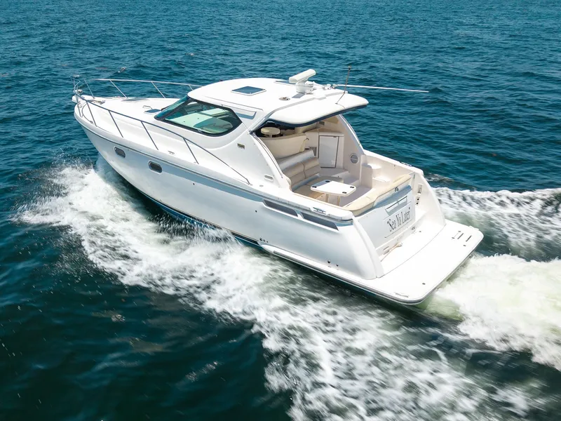 Slide: The Image of A 2008 Tiara Yachts 4300 Sovran cruising on open water. - 4