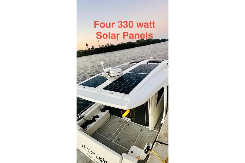 Slide: The Image of 2021 Greenline 39 Hybrid boat with four 330-watt solar panels on the roof. - 30