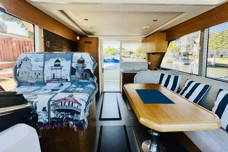 Slide: The Image of Interior of 2021 Greenline 39 Hybrid yacht with nautical decor and striped cushions. - 17
