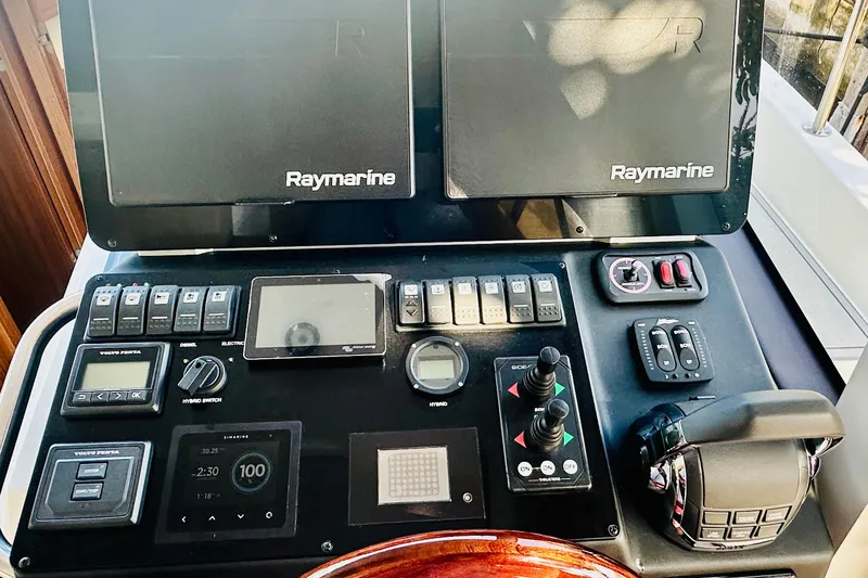 Slide: The Image of Control panel of 2021 Greenline 39 Hybrid boat with Raymarine navigation systems. - 15