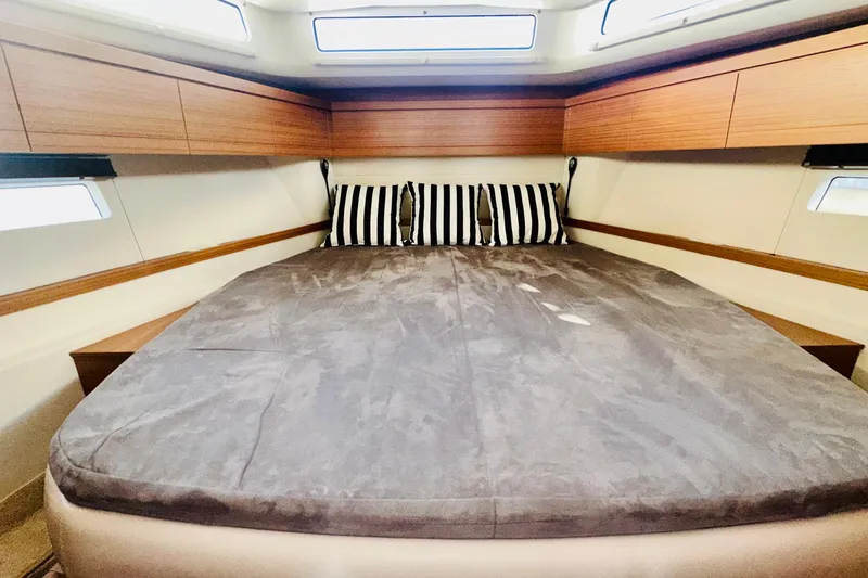 Slide: The Image of Luxurious cabin interior of 2021 Greenline 39 Hybrid yacht with striped pillows. - 19