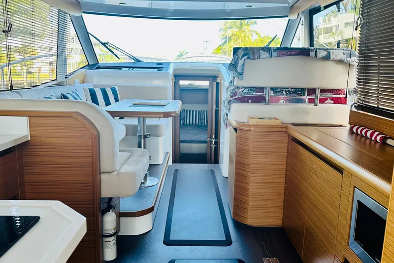 Slide: The Image of Interior of 2021 Greenline 39 Hybrid yacht, featuring modern seating and wooden finishes. - 8