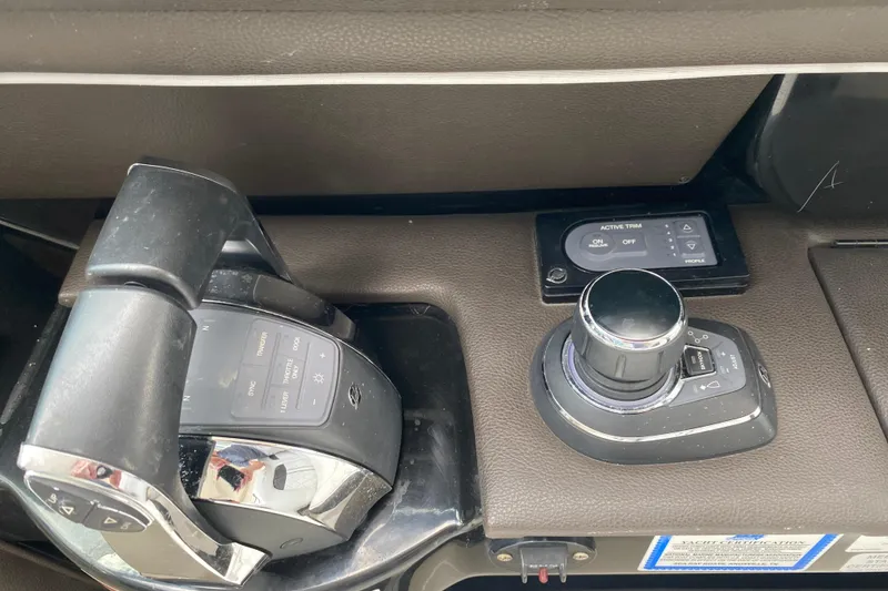 Slide: The Image of Control panel of a 2018 Sea Ray SLX 350 boat with throttle and joystick. - 30