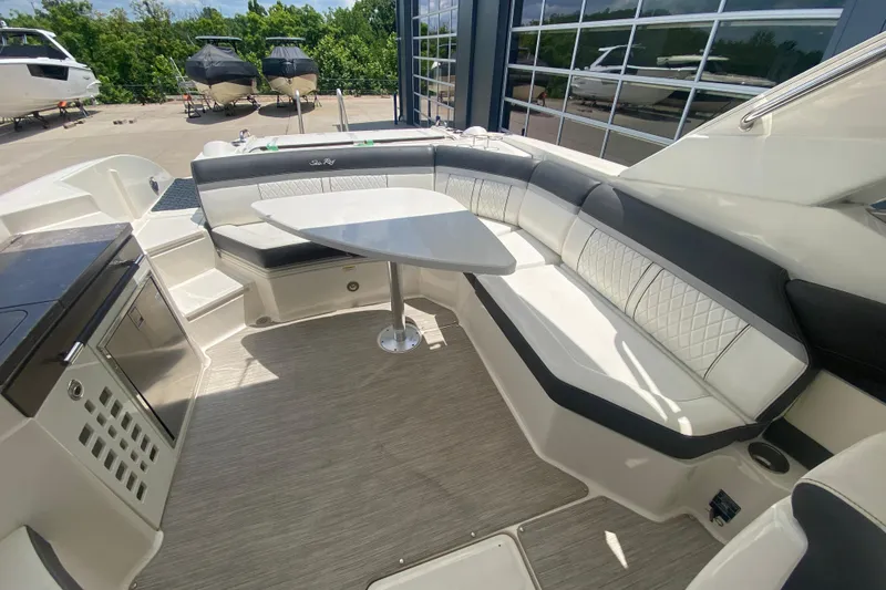 Slide: The Image of 2018 Sea Ray SLX 350 boat interior with sleek seating and modern amenities. - 18