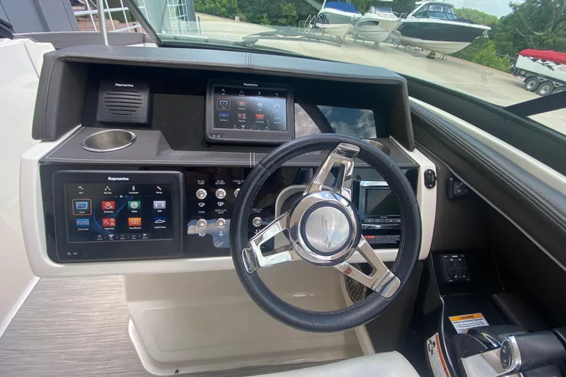 Slide: The Image of 2018 Sea Ray SLX 350 dashboard with advanced navigation and control systems. - 24