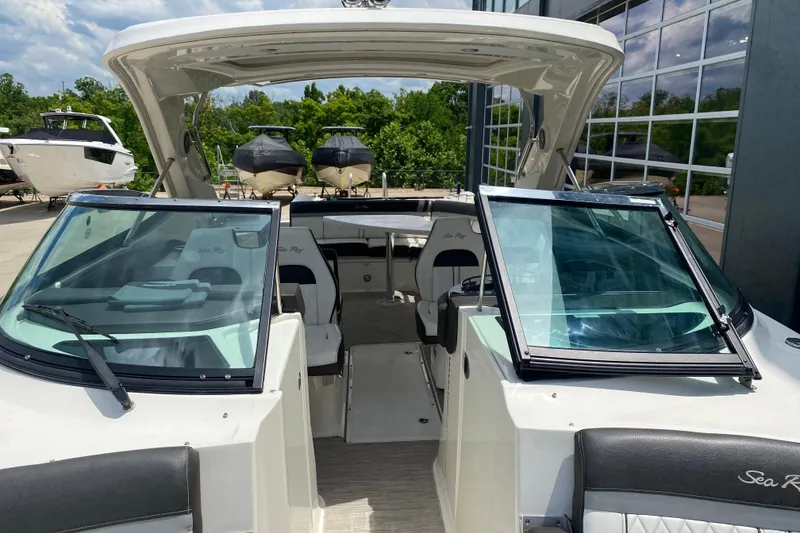 Slide: The Image of 2018 Sea Ray SLX 350 boat with open cockpit and sleek design, docked outdoors. - 40