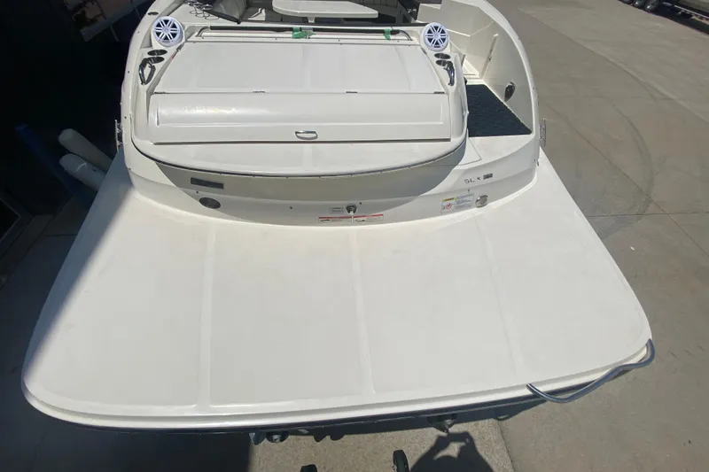 Slide: The Image of 2018 Sea Ray SLX 350 boat stern view with speakers and swim platform. - 10