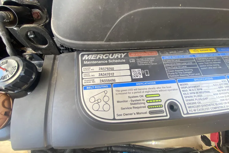 Slide: The Image of Mercury engine maintenance schedule label on a 2018 Sea Ray SLX 350 boat. - 48