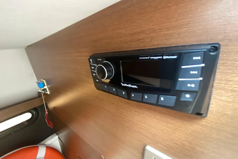 Slide: The Image of Control panel on 2018 Sea Ray SLX 350 boat interior, featuring audio system. - 33