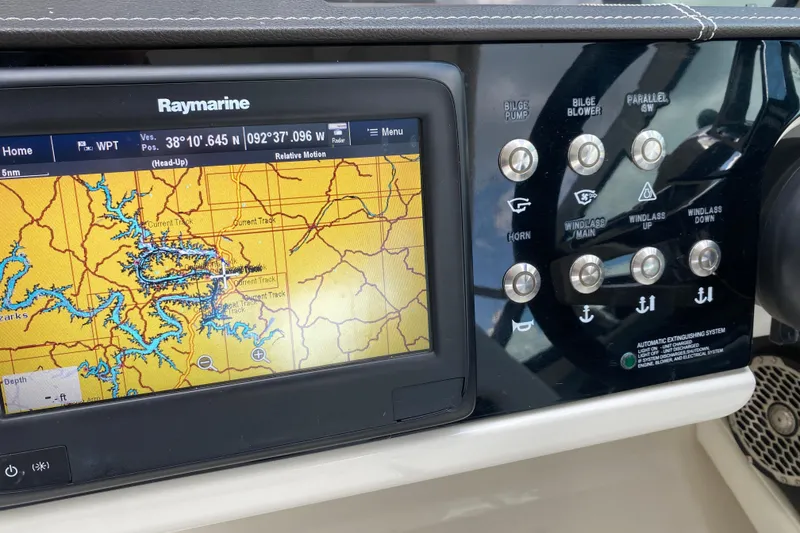 Slide: The Image of Control panel of a 2018 Sea Ray SLX 350 with navigation display. - 28
