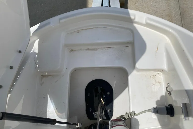 Slide: The Image of 2018 Sea Ray SLX 350 boat anchor compartment with visible hardware and cables. - 39