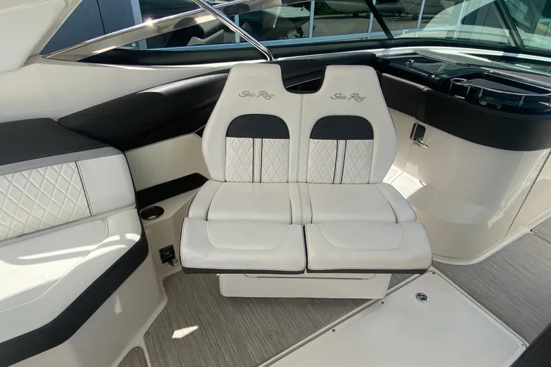 Slide: The Image of 2018 Sea Ray SLX 350 boat interior with luxurious white seating and elegant design. - 20