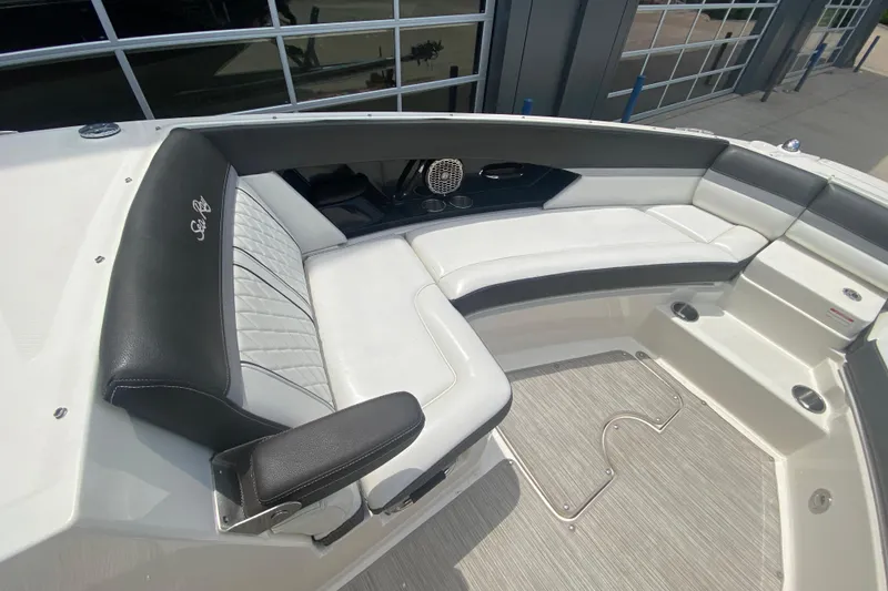 Slide: The Image of 2018 Sea Ray SLX 350 boat interior with luxurious white and black seating. - 36