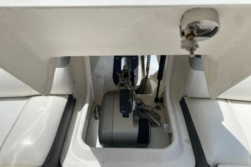 Slide: The Image of 2018 Sea Ray SLX 350 anchor compartment with winch and chain storage. - 38