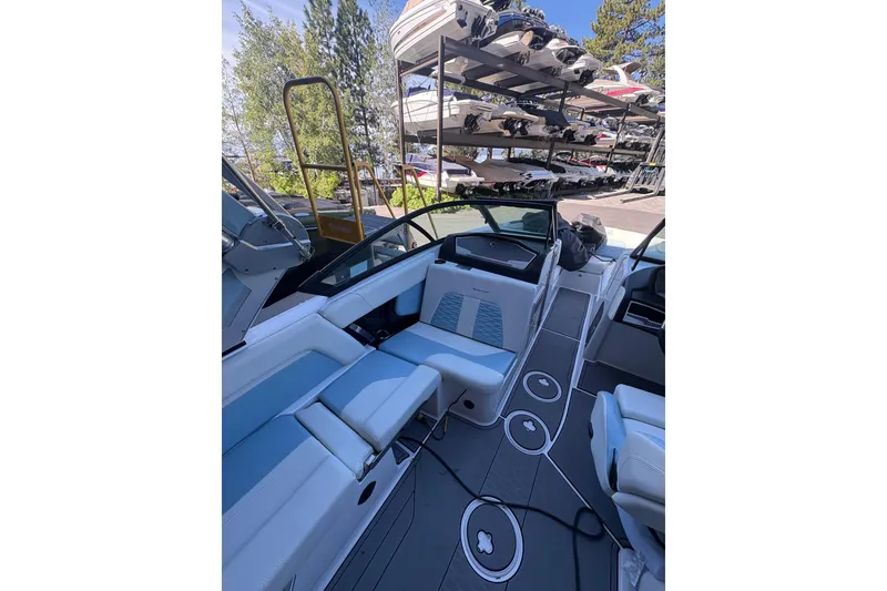 Slide: The Image of 2022 MasterCraft X24 boat interior with sleek seating and modern design. - 5