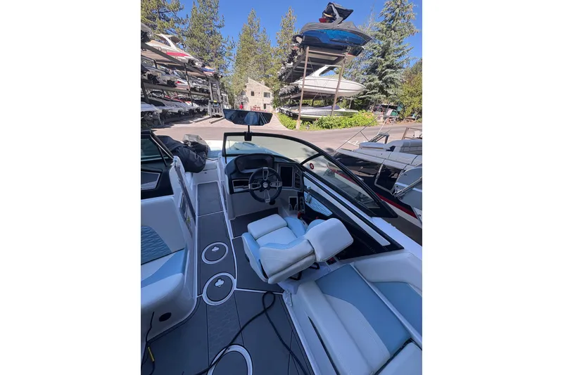 Slide: The Image of Interior view of 2022 MasterCraft X24 boat with modern dashboard and seating. - 6