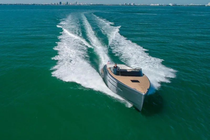 Slide: The Image of 2018 Canard Yachts eMotion HYBRID cruising on open water, leaving a wake behind. - 1