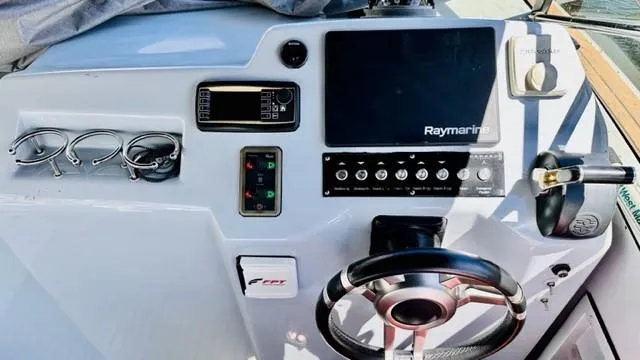 Slide: The Image of Control panel of 2018 Canard Yachts eMotion HYBRID with steering wheel and Raymarine display. - 17