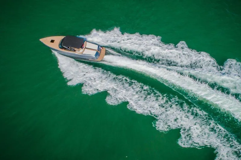 Slide: The Image of Aerial view of 2018 Canard Yachts eMotion HYBRID cruising on vibrant green water. - 3