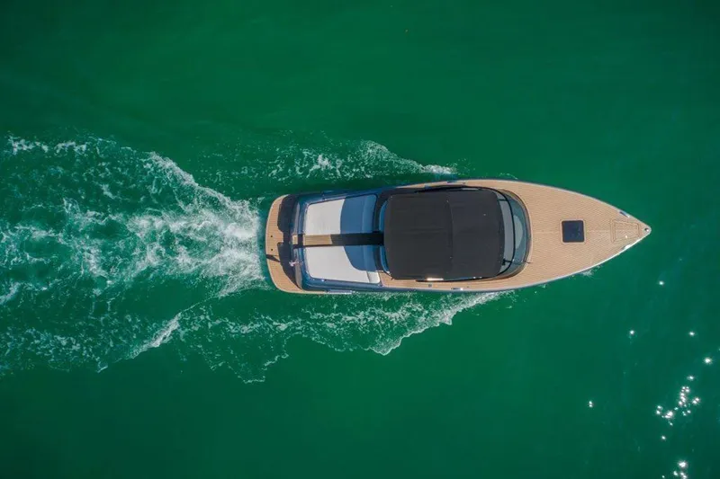 Slide: The Image of Aerial view of 2018 Canard Yachts eMotion HYBRID cruising on turquoise water. - 7
